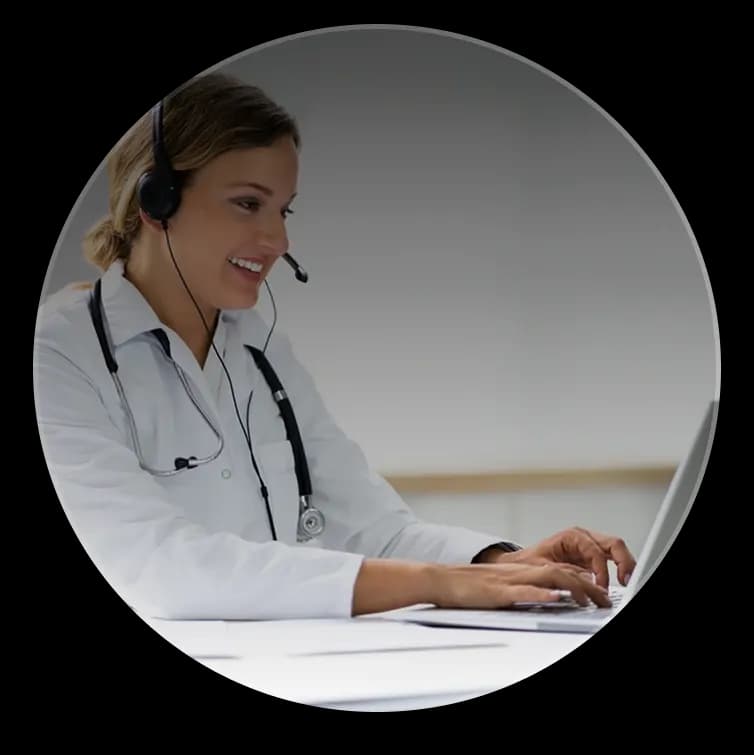 Monitoring nurse wearing headset speaking with patient, representing real-time chronic care support.