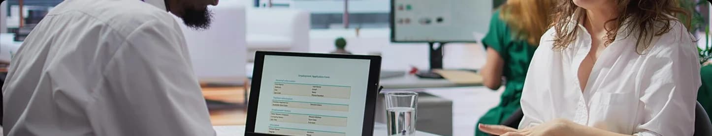 Clinician at desk supporting patient care.