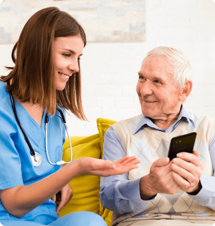 Nurse showing patient how to use phone
